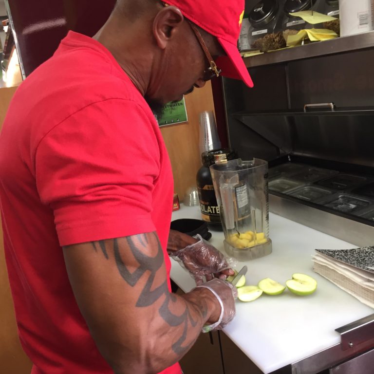 Mark Schand making a smoothie at his Sweetwater cafe