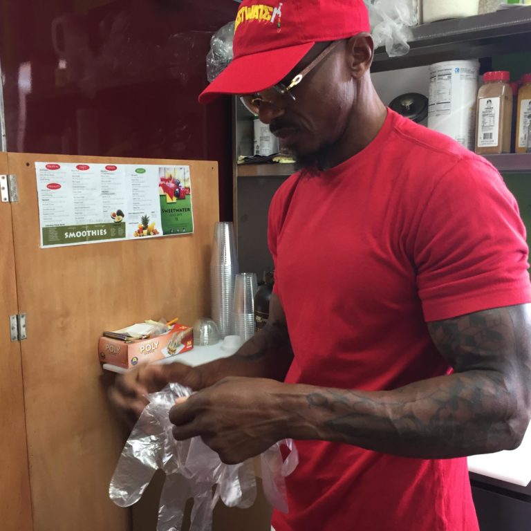 Mark Schand making a smoothie at his Sweetwater cafe.